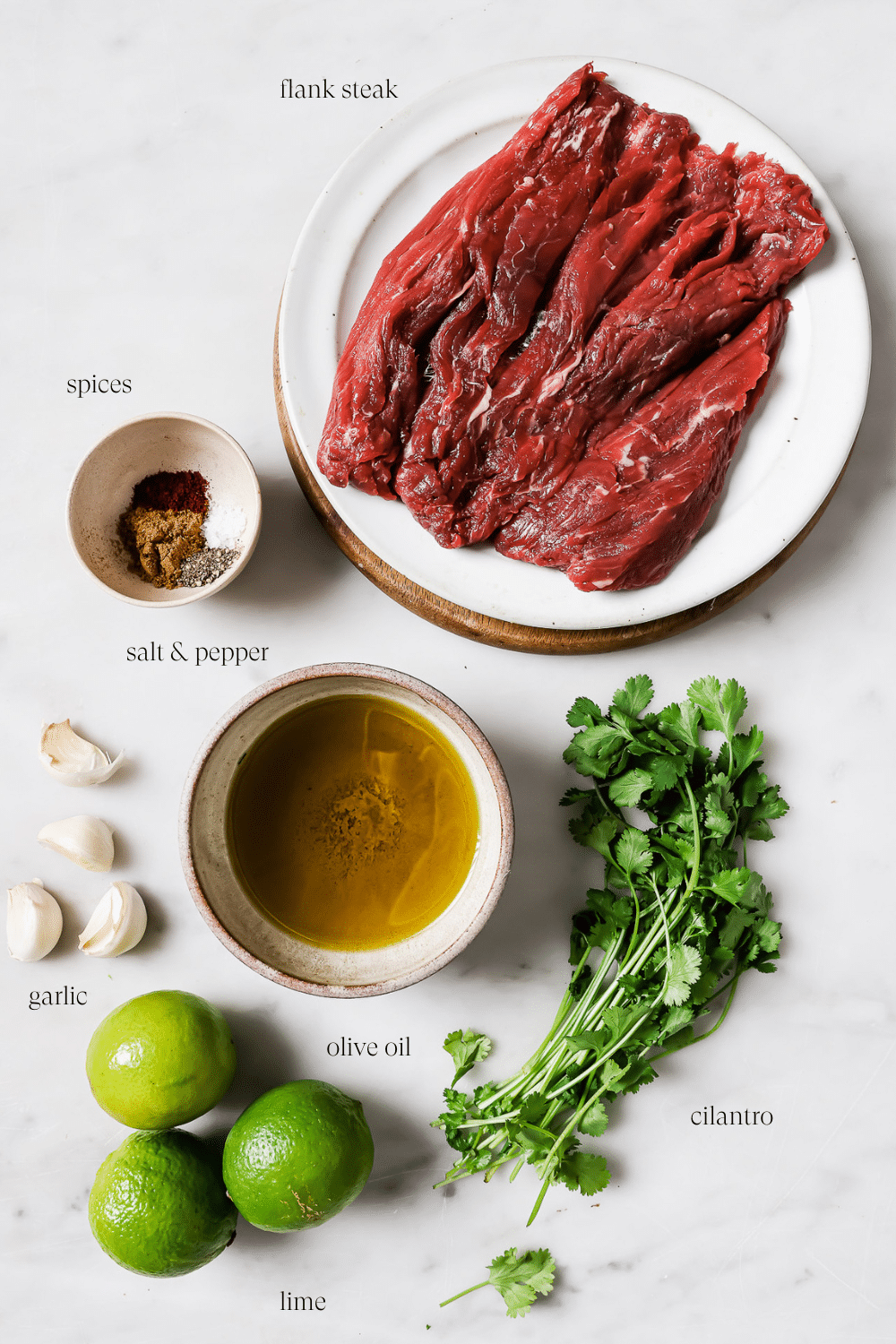 Carne asada ingredients against a white background.