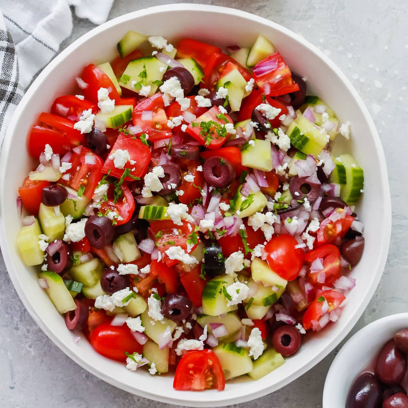 Easy Mediterranean salad in a white bowl. 