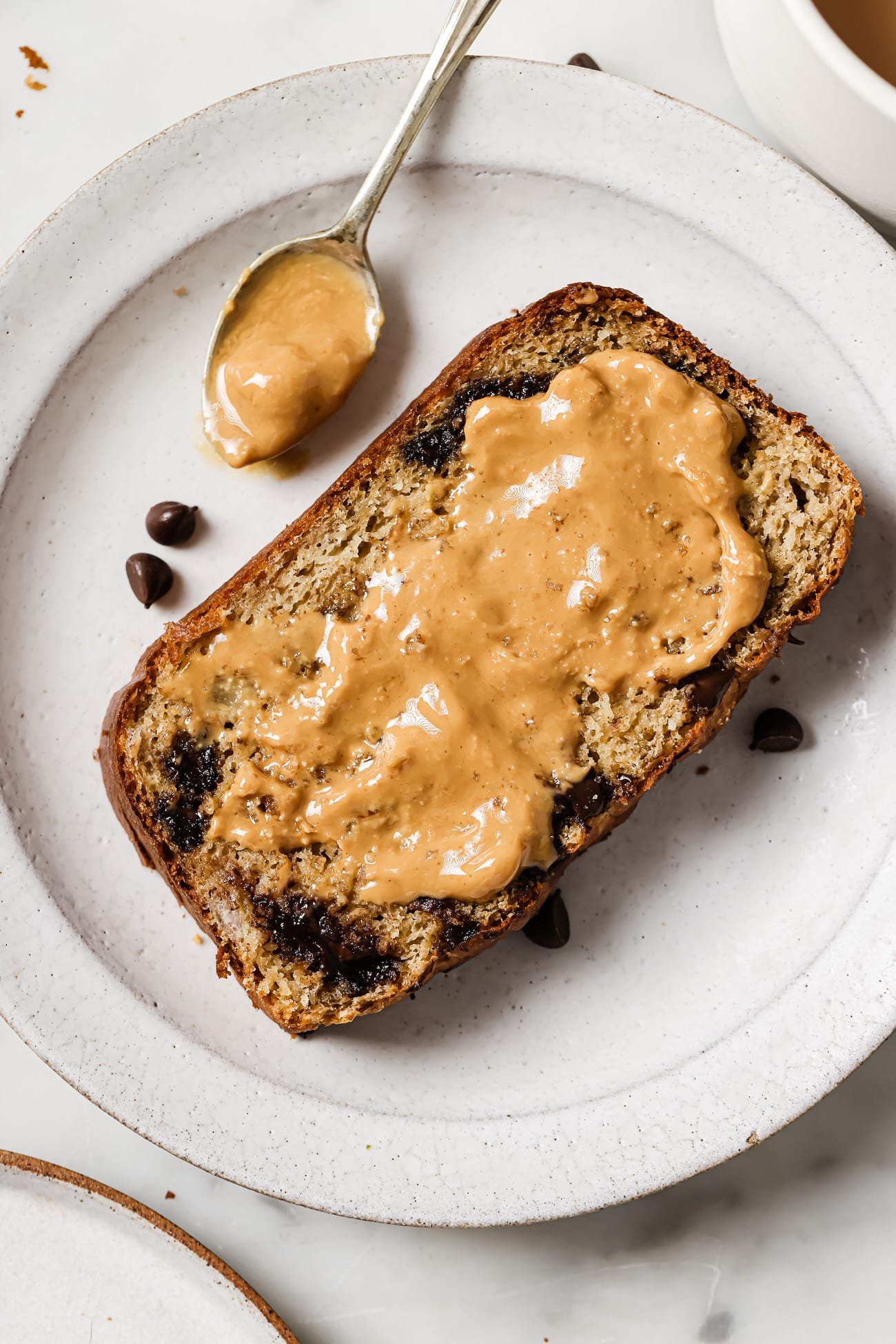 High protein banana bread with peanut butter spread on top.