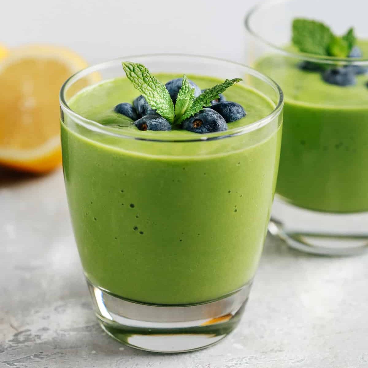 Low-carb green smoothie topped with blueberries.