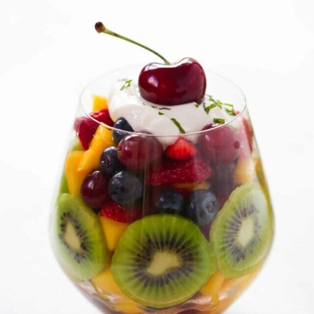 Fruit salad in a glass cup.