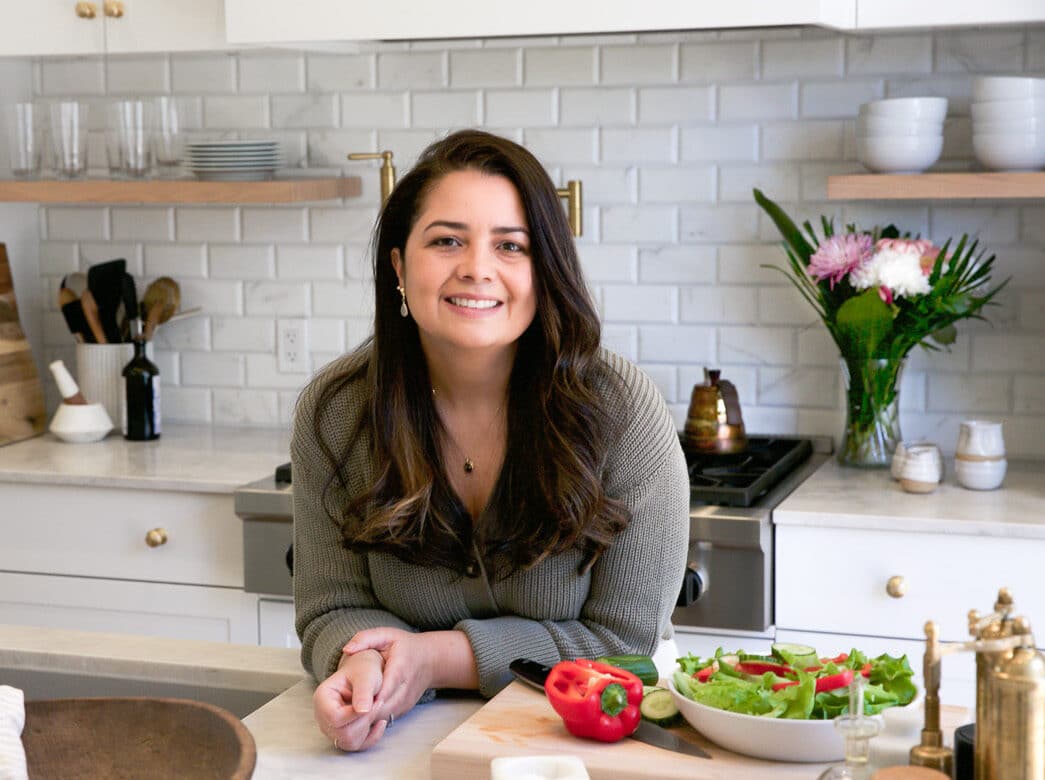 A photo of Olivia the founder of Primavera Kitchen in her kitchen
