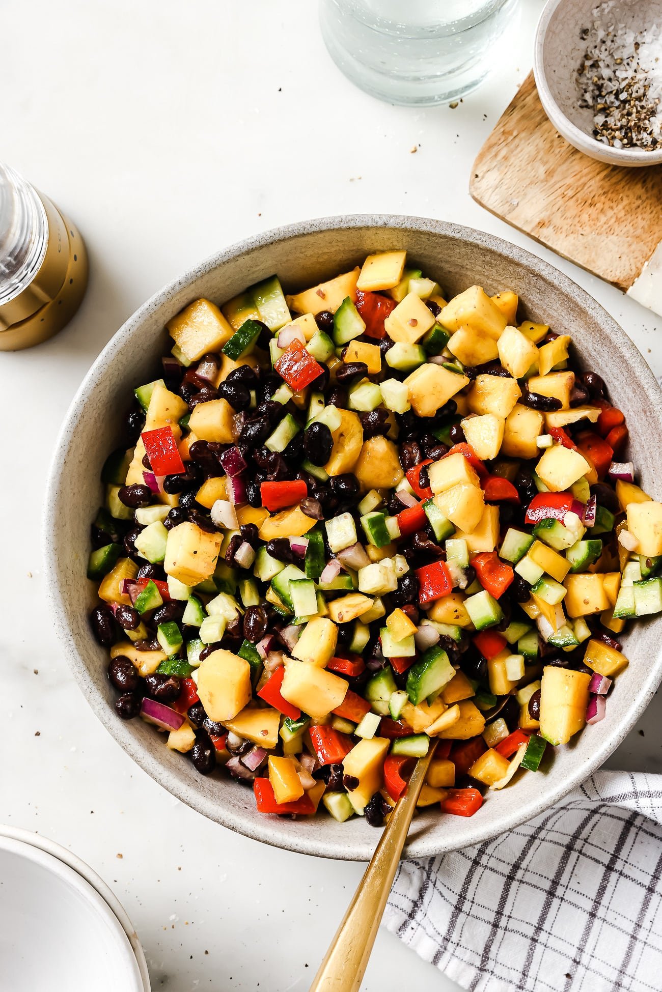 Overhead of a black bean mango salad in a bowl.
