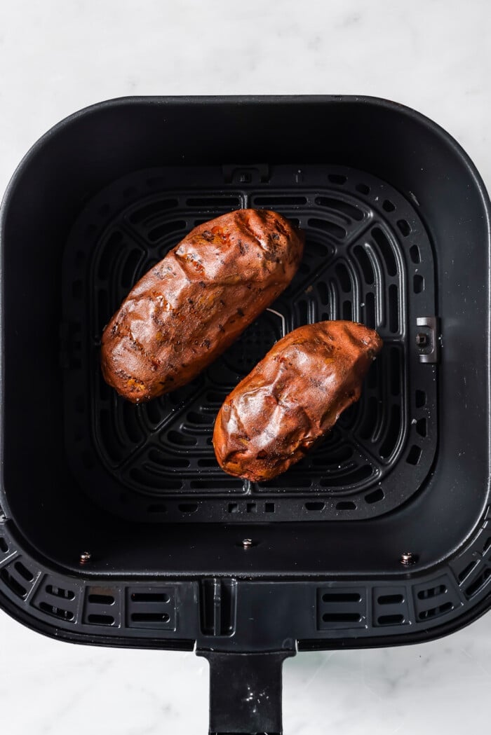 cooked sweet potato in a air fryer basket