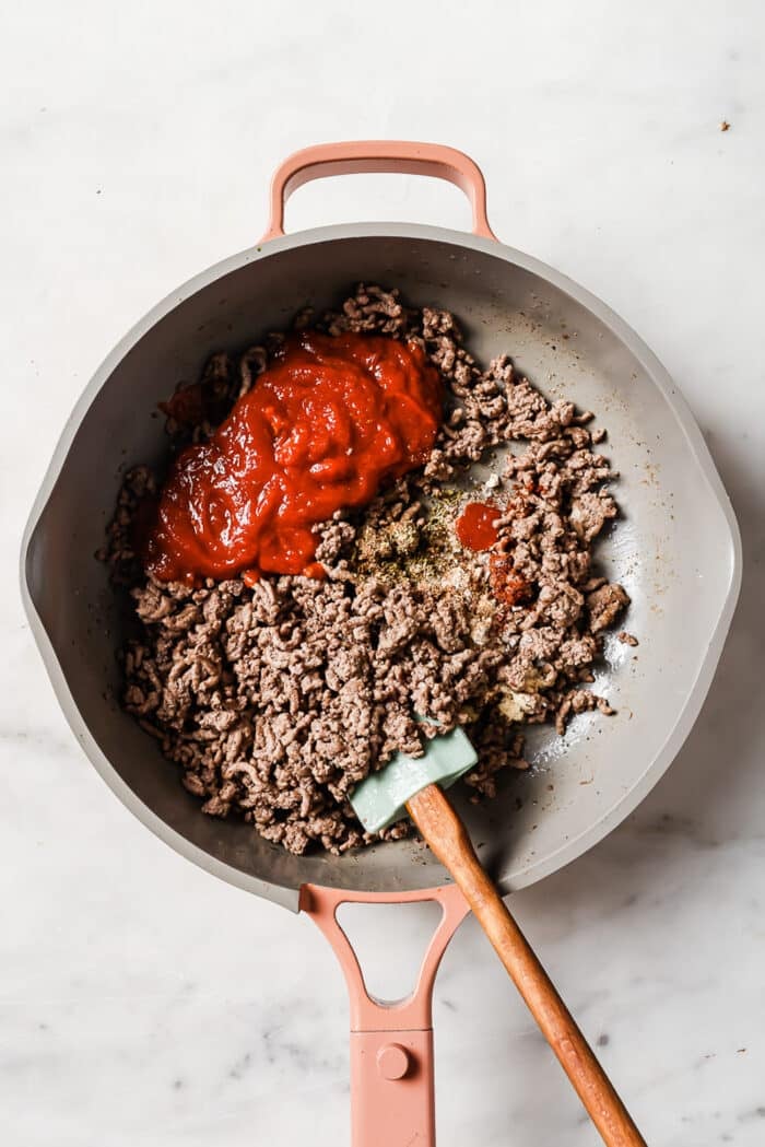 ground beef and tomato sauce in a skillet