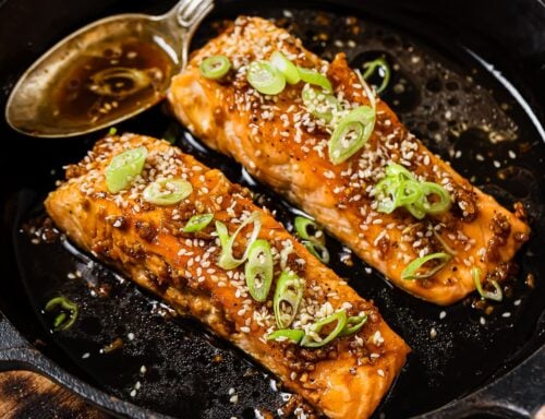 honey garlic salmon in a cast iron skillet