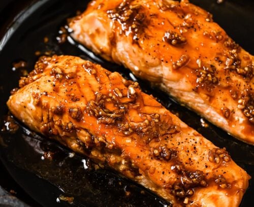 honey garlic salmon in a cast iron skillet