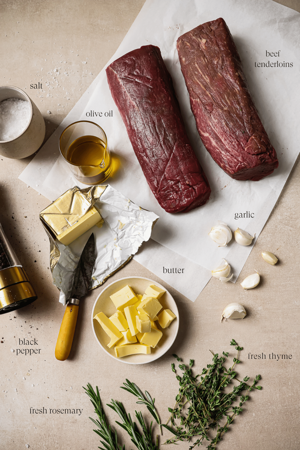 An overhead view of prepped ingredients on a white countertop.