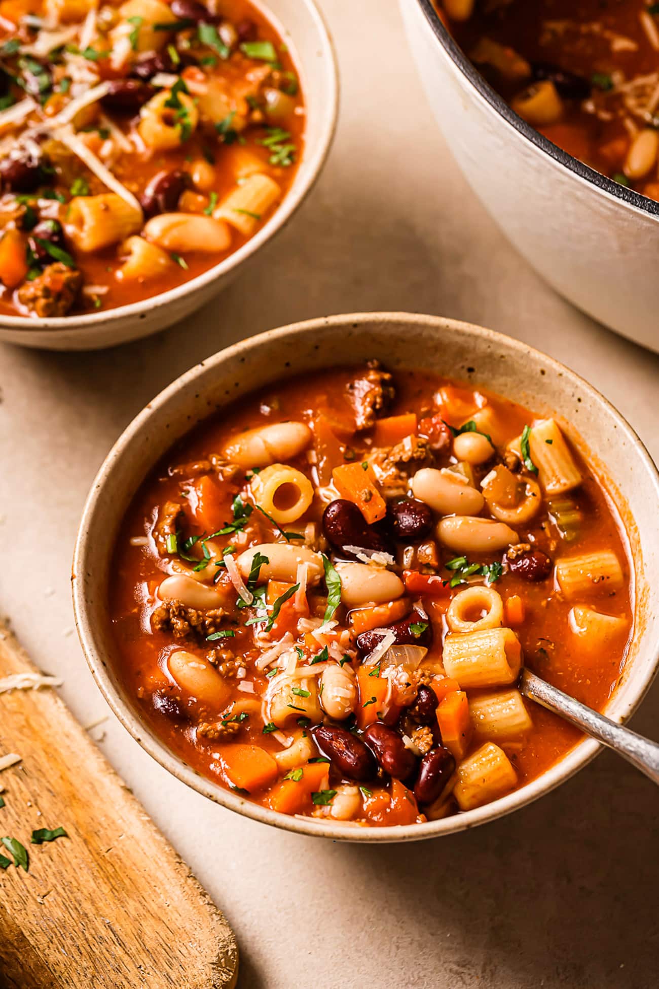 An overhead view of a large bowl of pasta e fagioli soup.