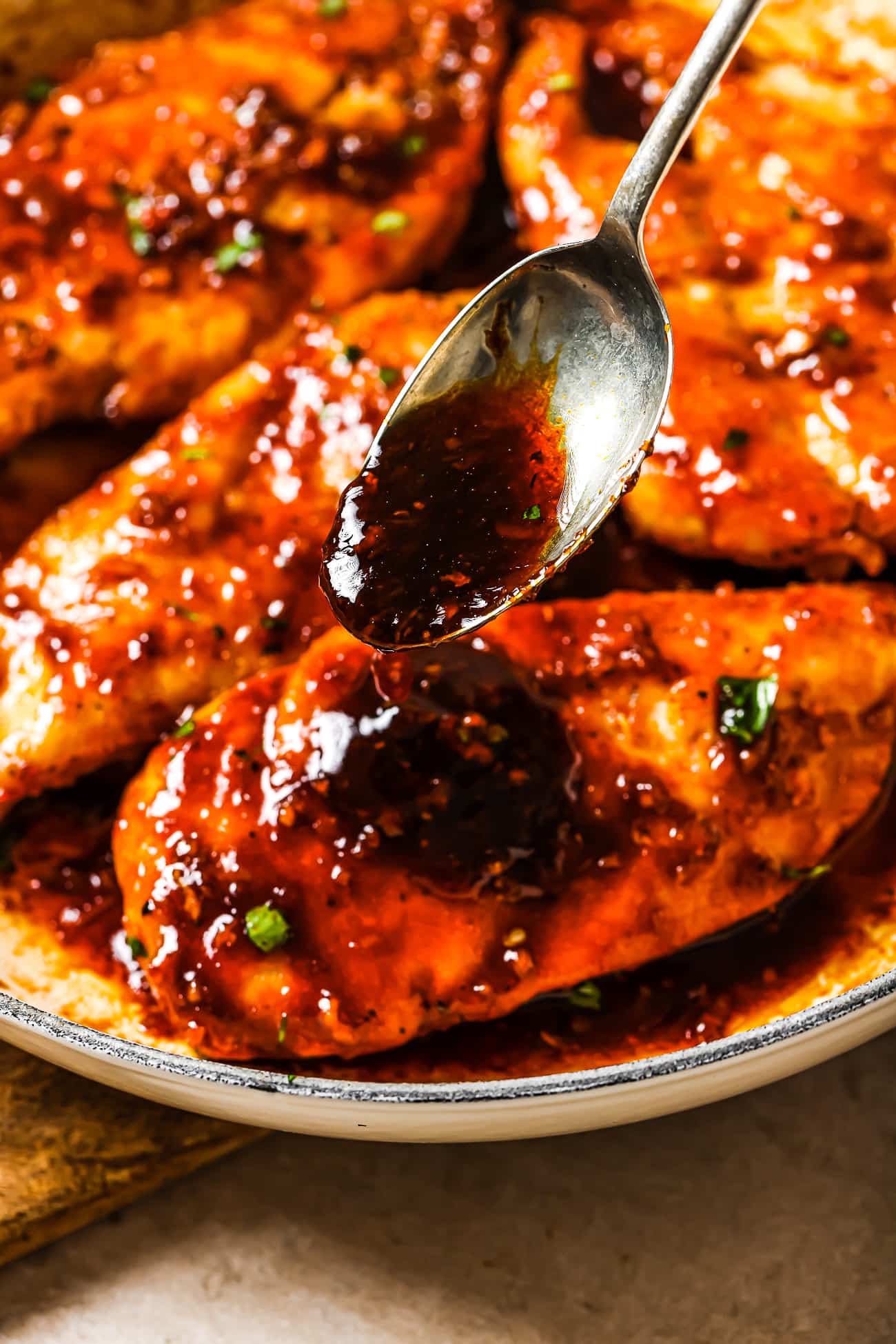 Chicken cutlets with honey garlic sauce spooned over the top. 