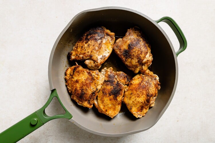 chicken thighs in a skillet