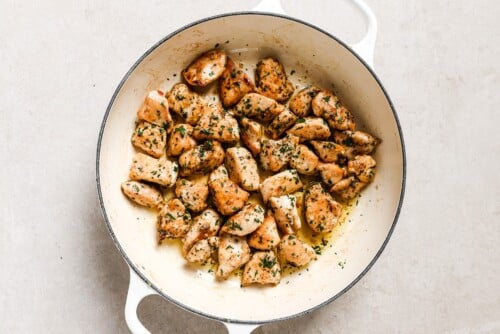 chicken bites in a white skillet