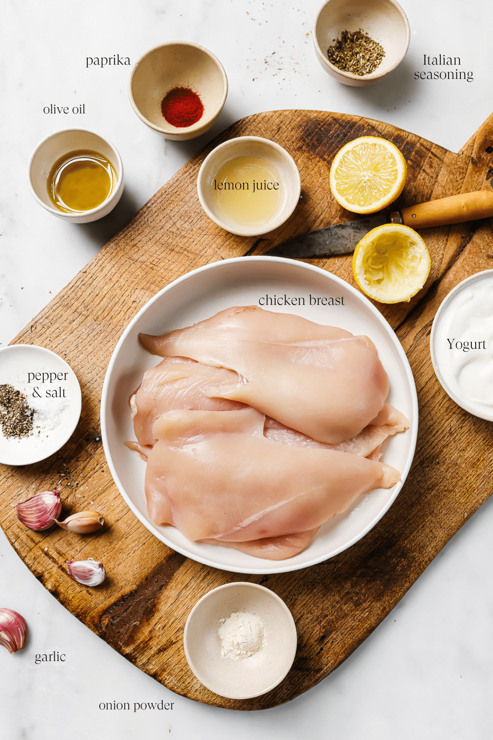 Pre-measured ingredients on a wooden cutting board with text overlay for each ingredient. 