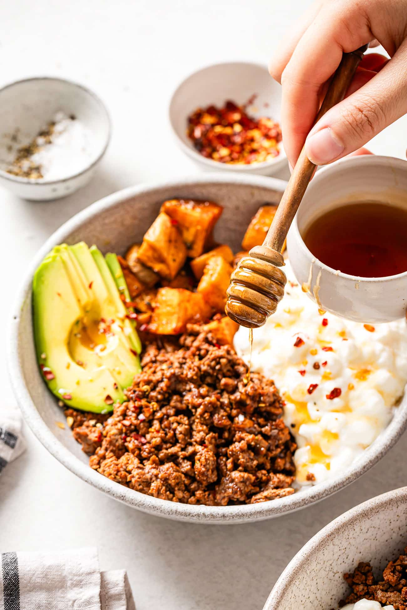 overhead view of Cottage Cheese Taco Bowl with hot honey on top.