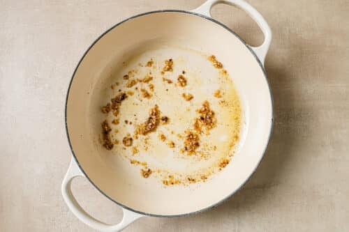 sauteed garlic in a braiser