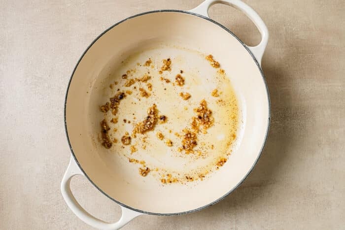 Minced garlic sautéing in the same Dutch oven in the leftover olive oil and butter.