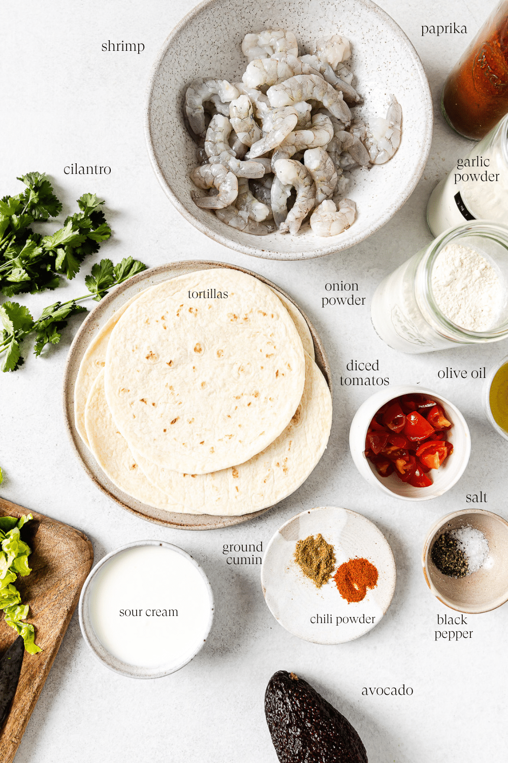 Pre-measured and labeled ingredients on a white countertop.