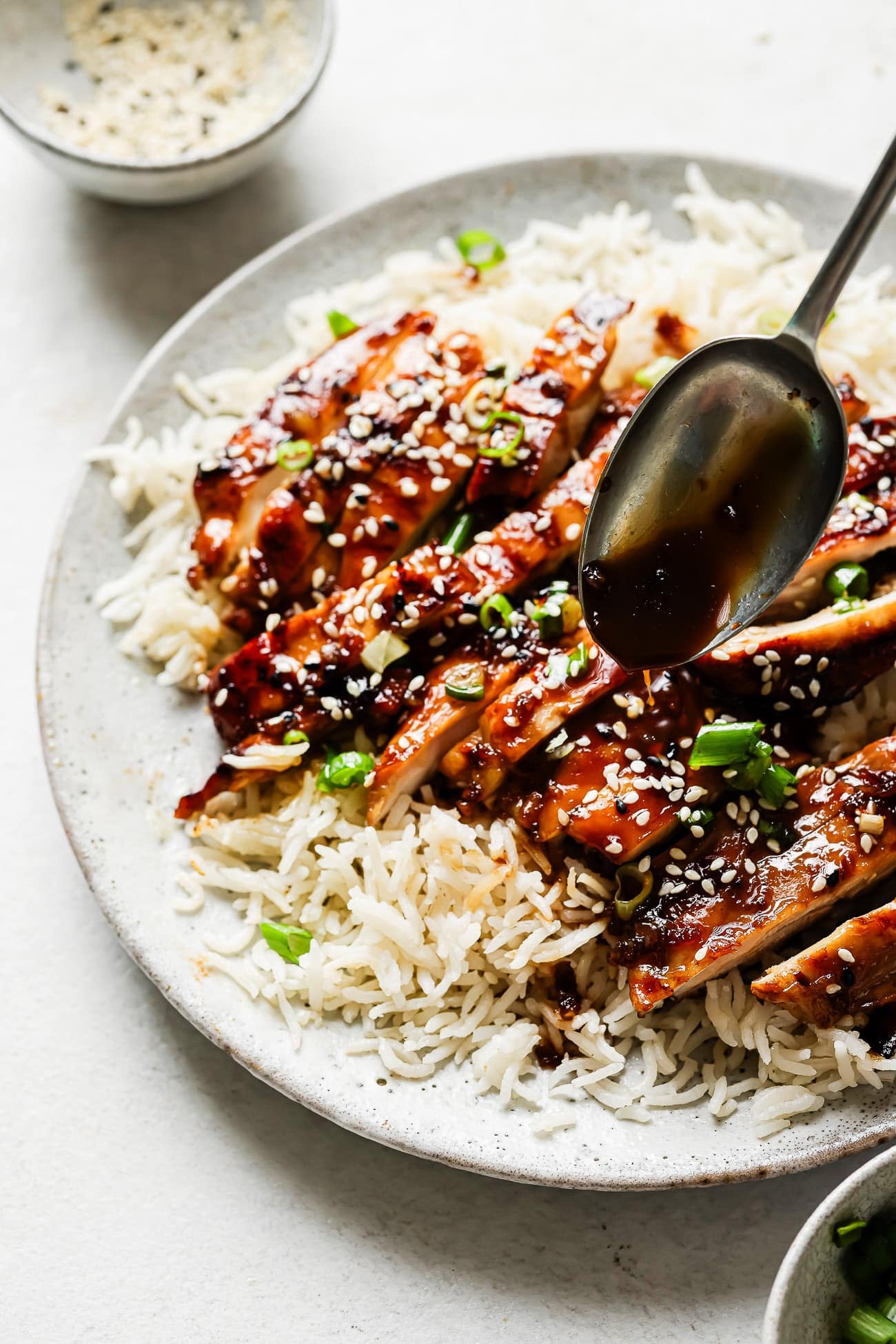 Teriyaki chicken on a bed of rice.
