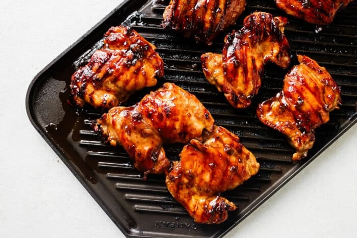 Cooking teriyaki chicken on a grill pan.