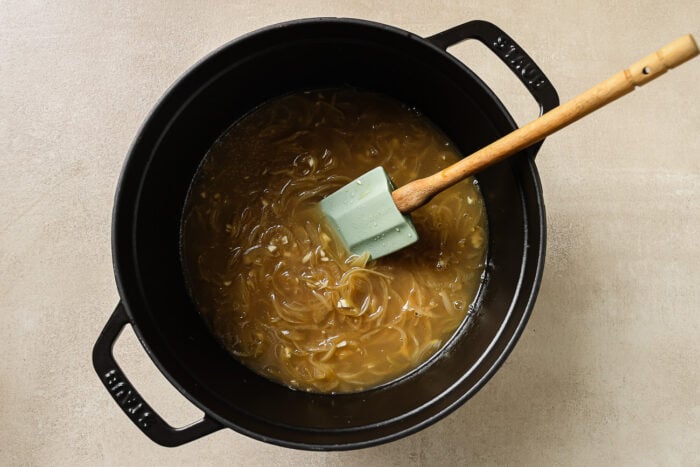 sauteed onions and apple cider in a Dutch oven pot. 