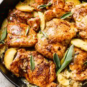 Apple cider chicken in a cast iron skillet.