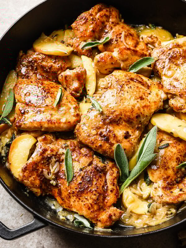 Apple cider chicken in a cast iron skillet.