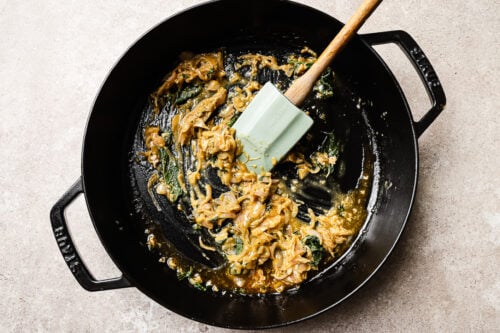 Sautéed onions in a cast iron skillet.