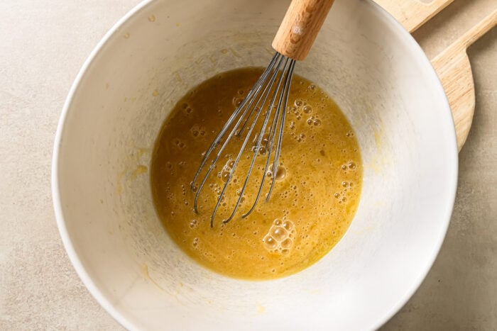 Wet baking ingredients inside a mixing bowl, ready to be combined.
