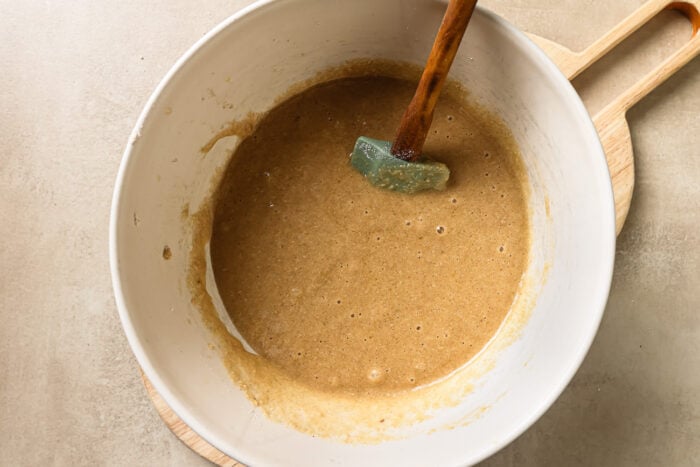 wet and dry ingredients inside a mixing bowl.