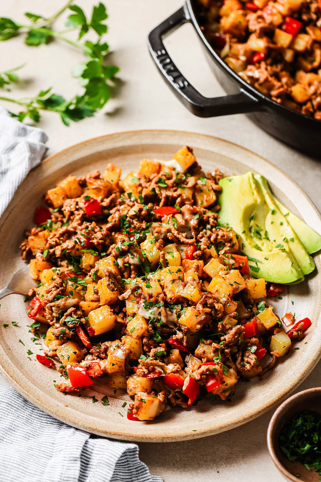 Close-up of ground beef and potatoes on a plate.