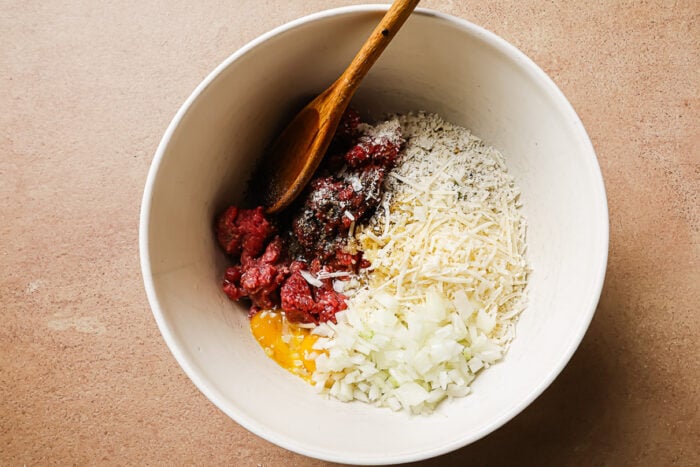 Ingredients in a bowl for making meatballs.