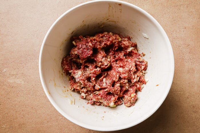Ingredients in a bowl for making meatballs.