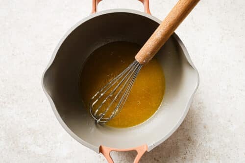 saucepan with melted butter, maple syrup, sugar, vanilla, salt, and milk.