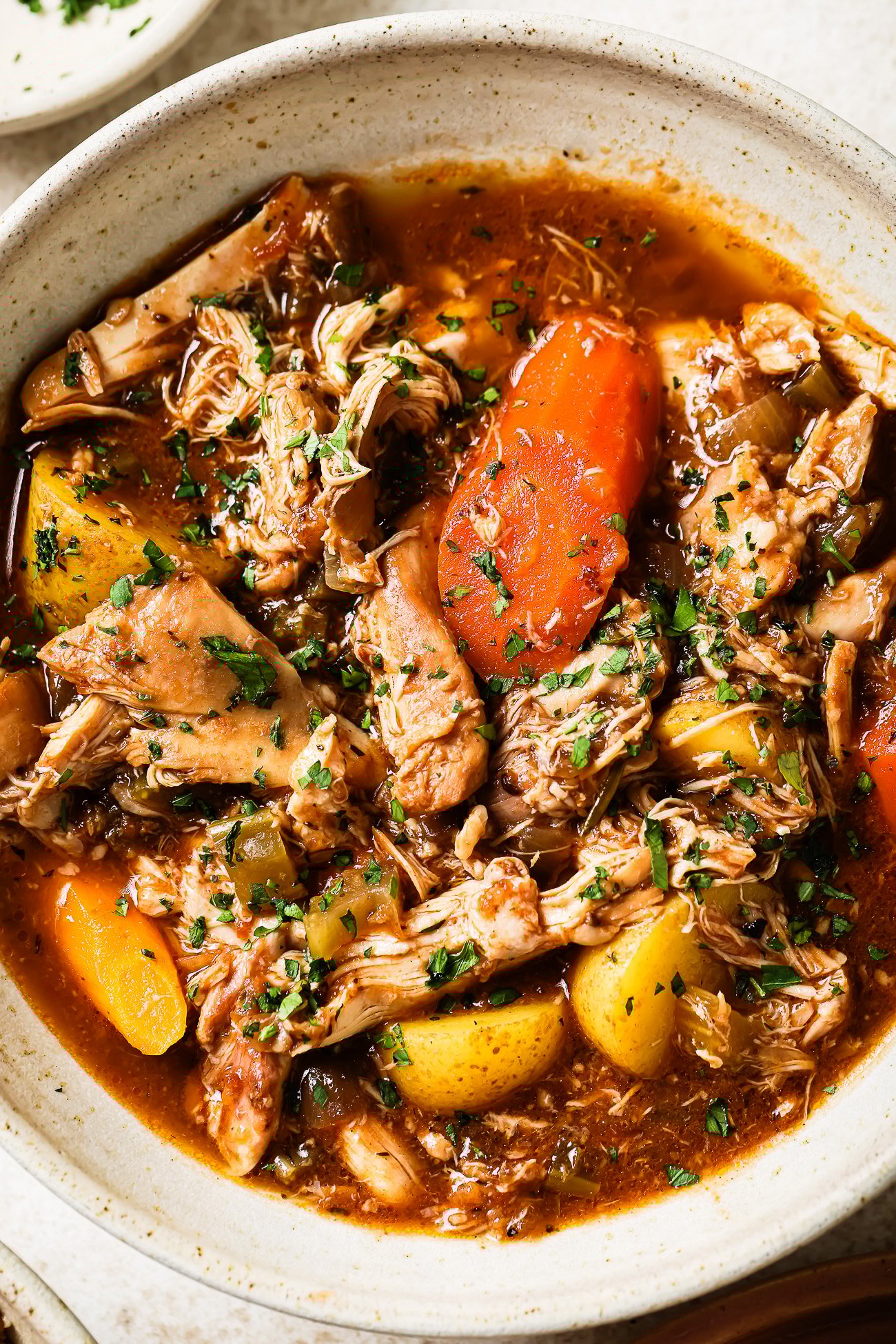 Overhead view of slow cooker chicken stew.