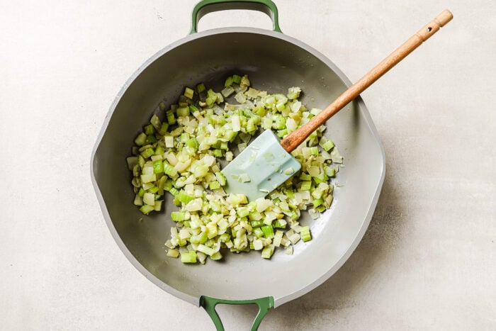 Golden sautéed onions inside a skillet.