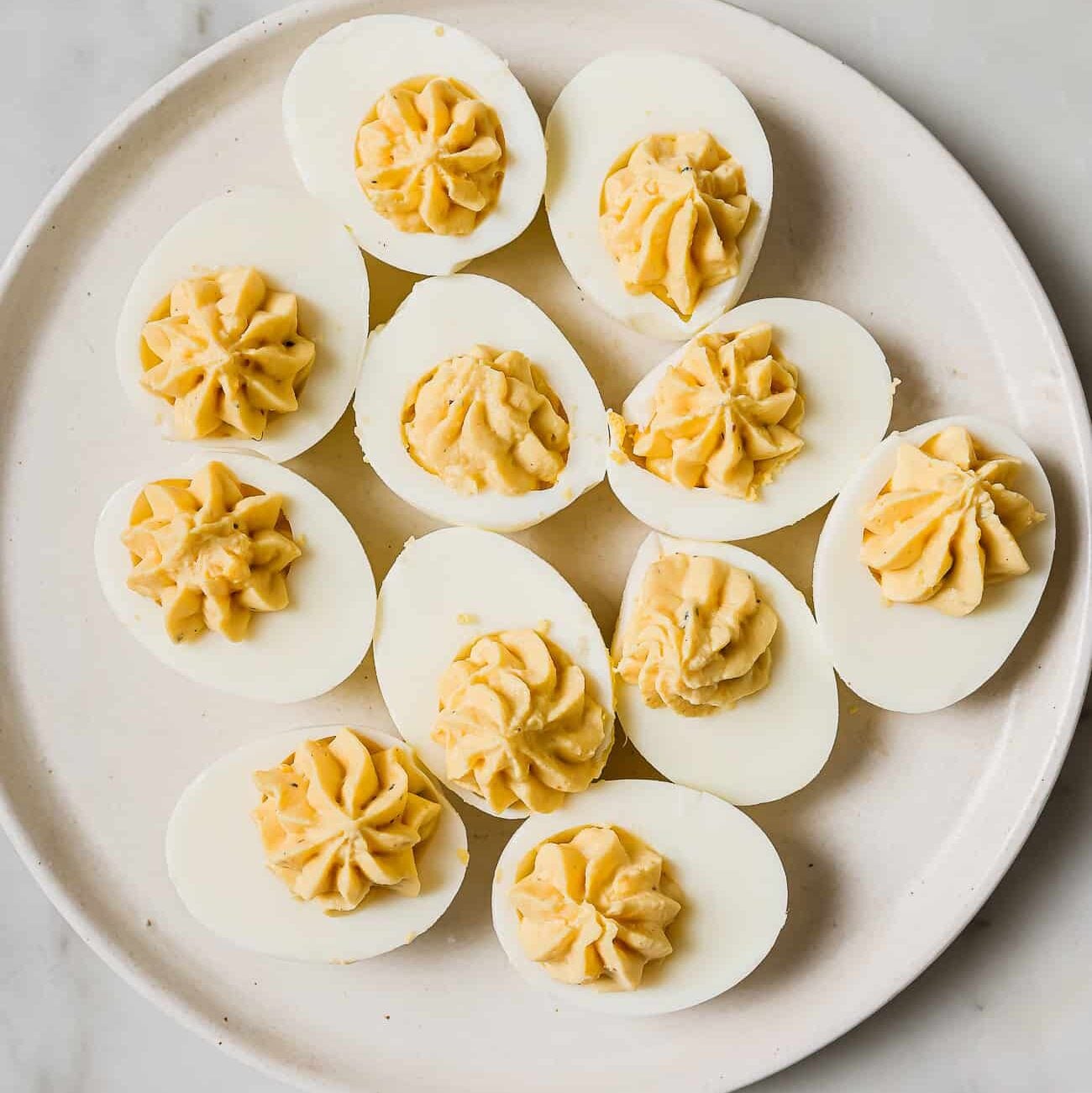 deviled eggs on a white plate