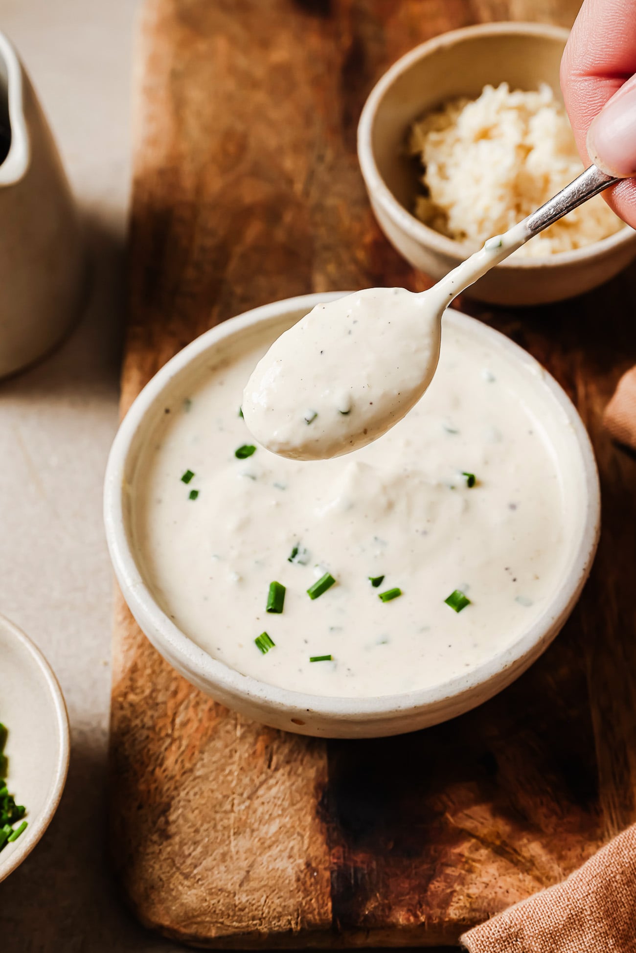 closeup view of horseradish sauce in a white bowl.