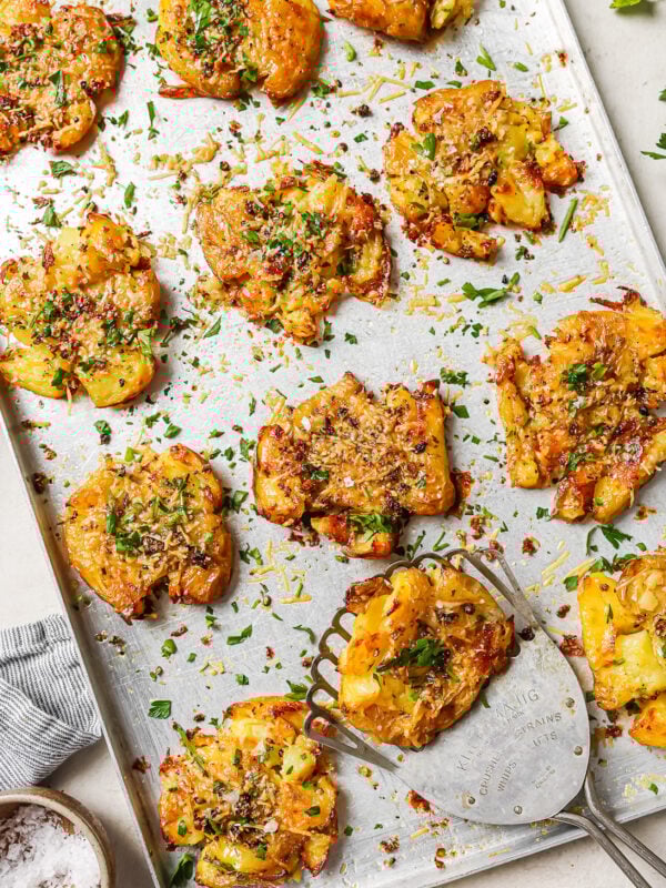 smashed potatoes on a baking sheet.
