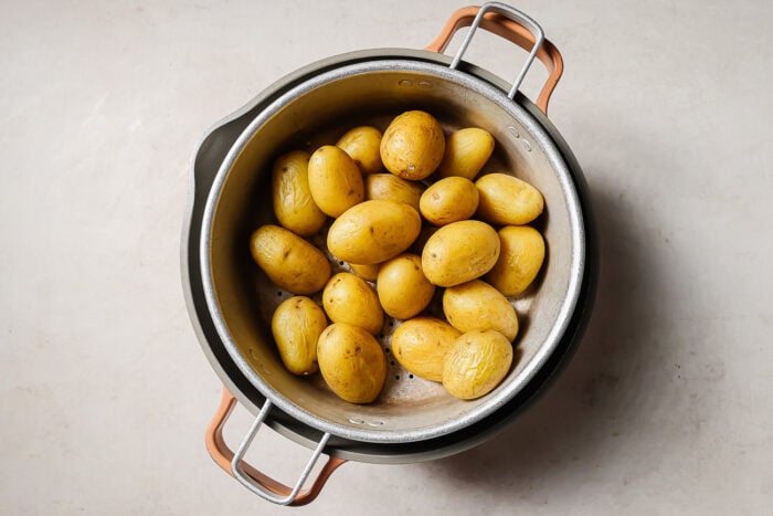 Drained potatoes in a colander.