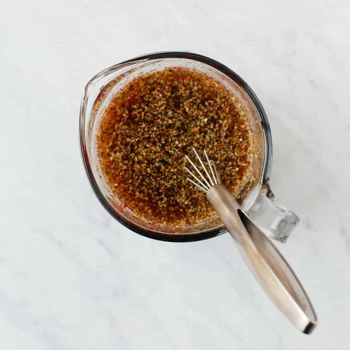 overhead view of a glass cup with broth inside