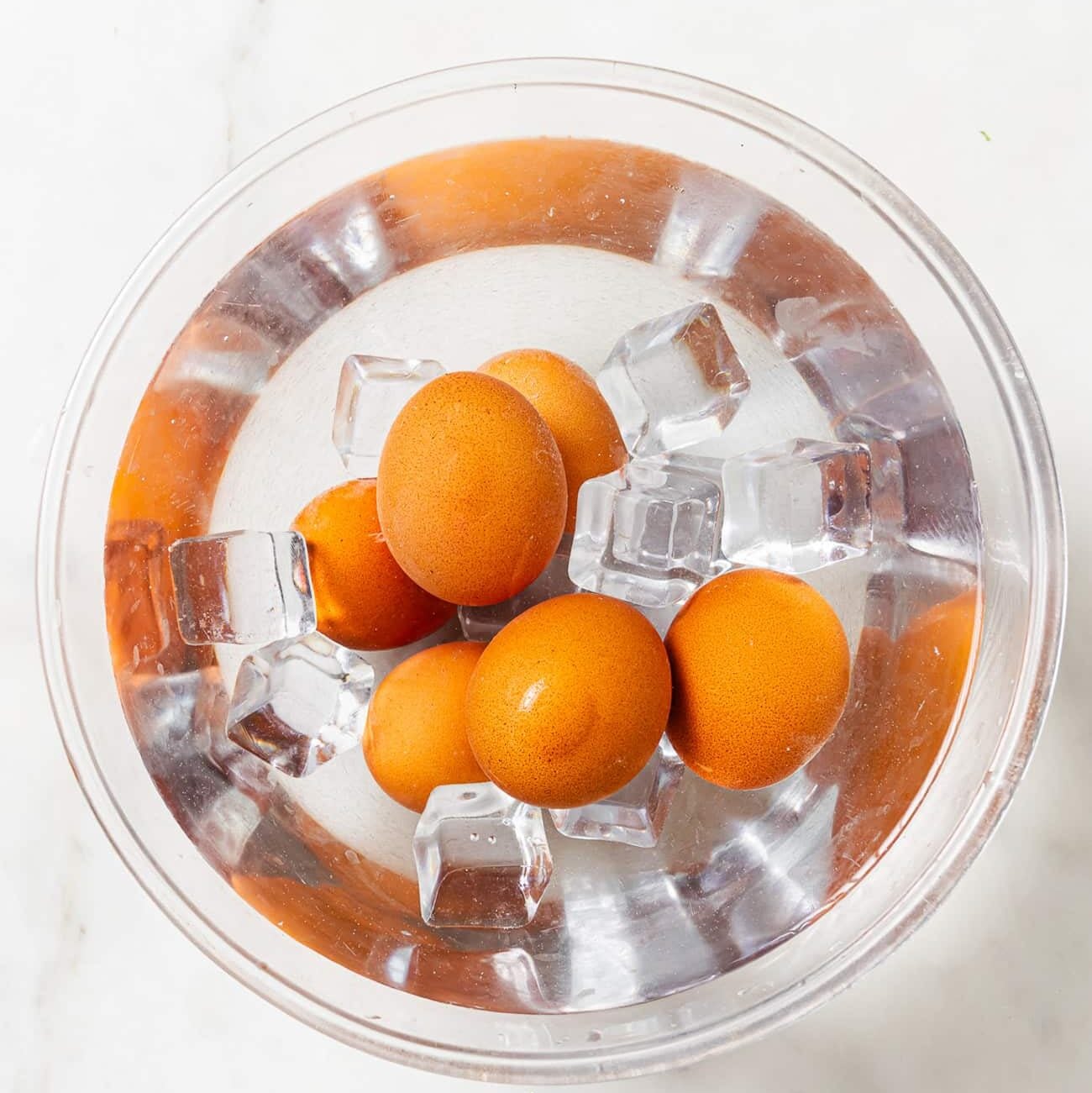 boiled eggs in a bowl with water and ice
