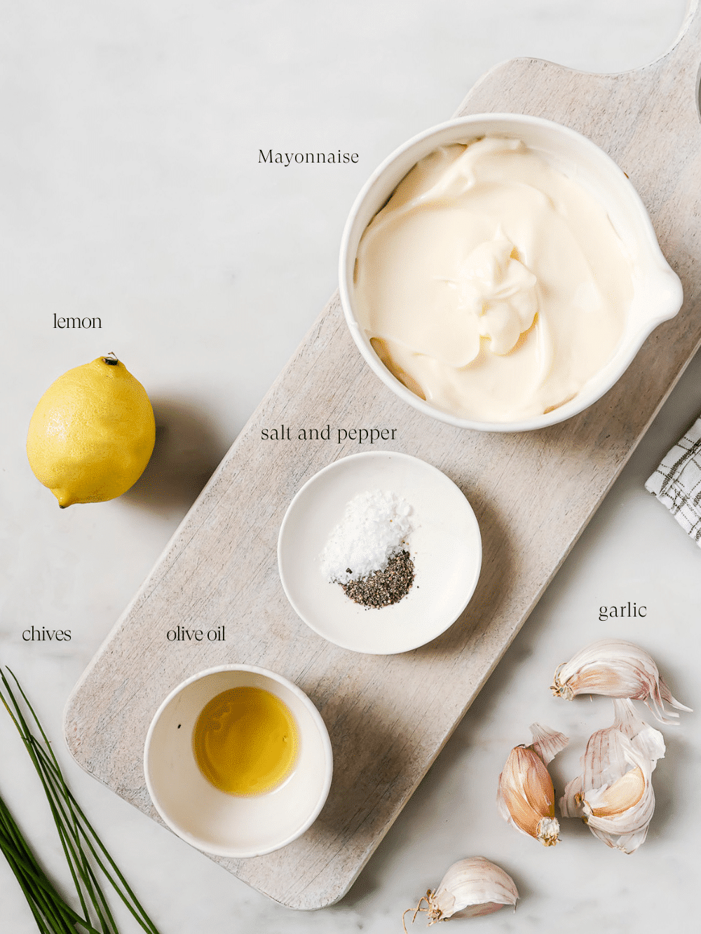 Pre-measured ingredients on a wooden cutting board.