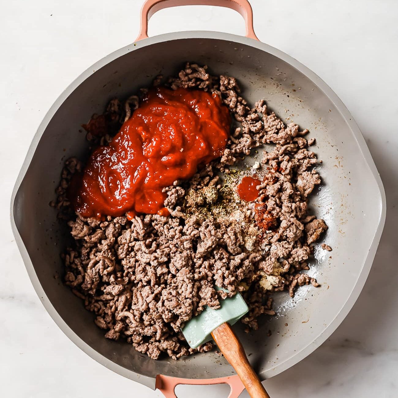 ground beef and tomato sauce in a skillet