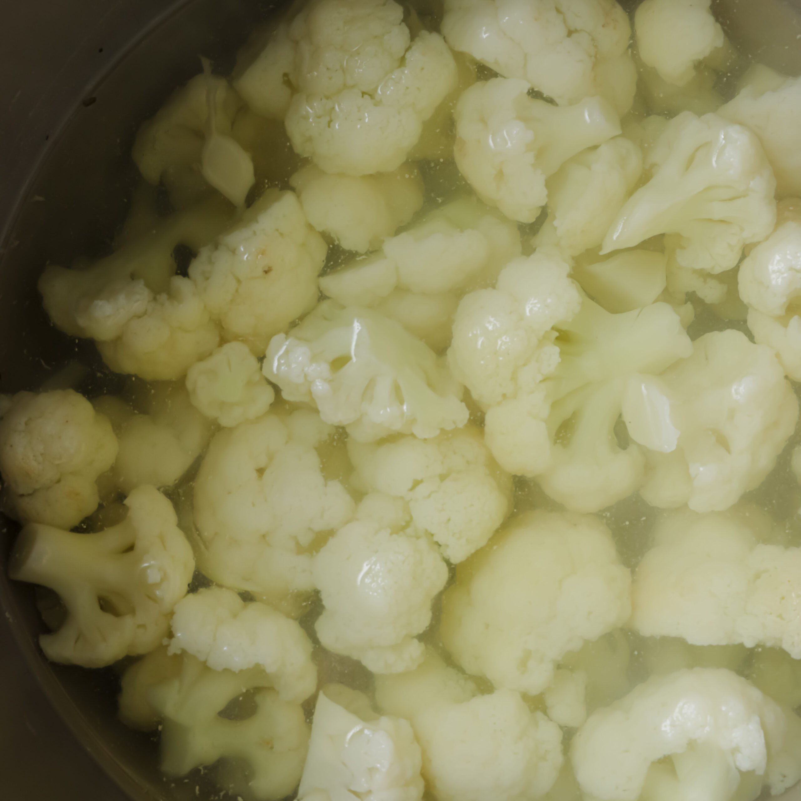 cauliflower in a pot of water.