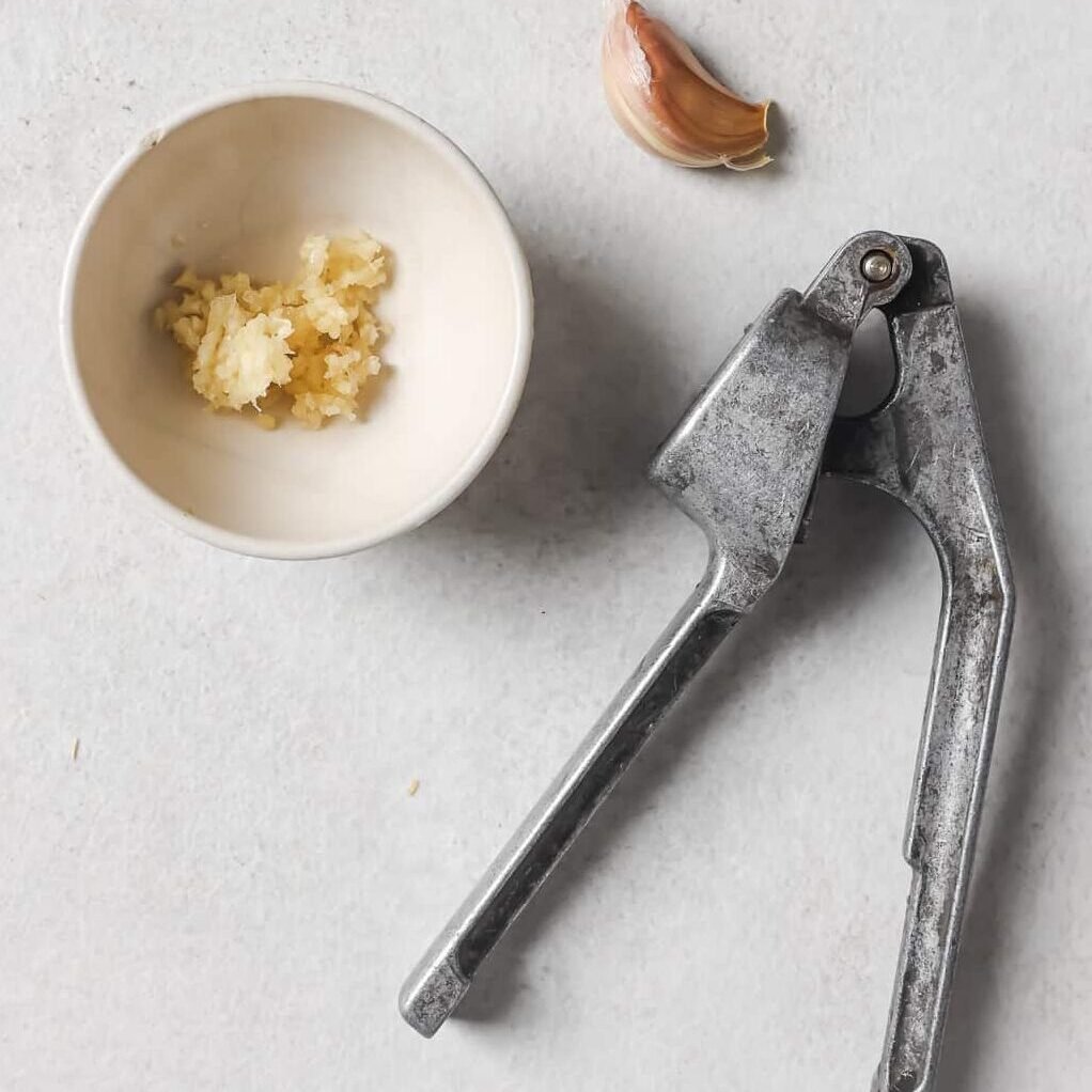 crushed garlic in a white bowl