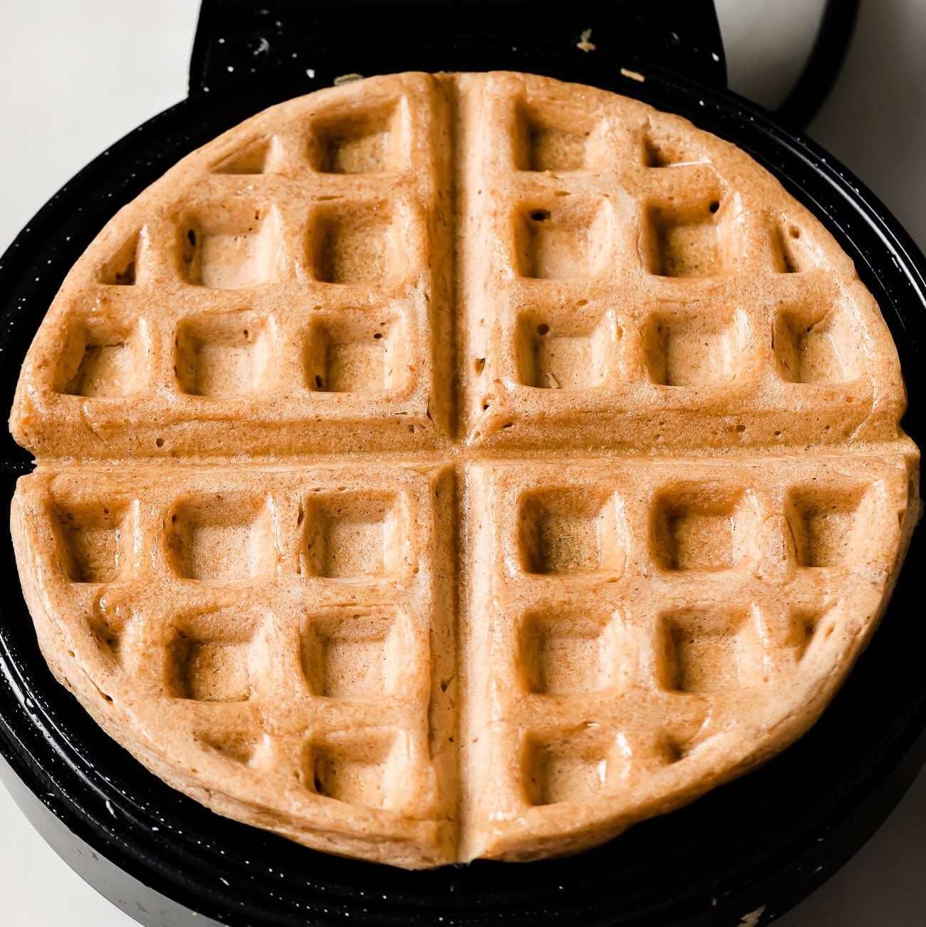 crispy waffles in a waffle machine.